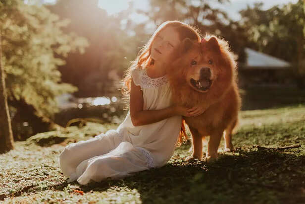 Girl Hugging Adult Chow C