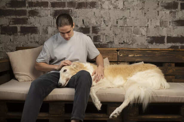 Man sitting with his dog